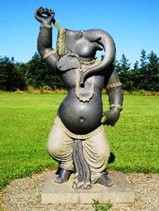 A statue of a person holding a staff

AI-generated content may be incorrect.