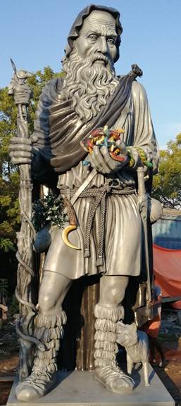 A statue of a person holding a staff

AI-generated content may be incorrect.